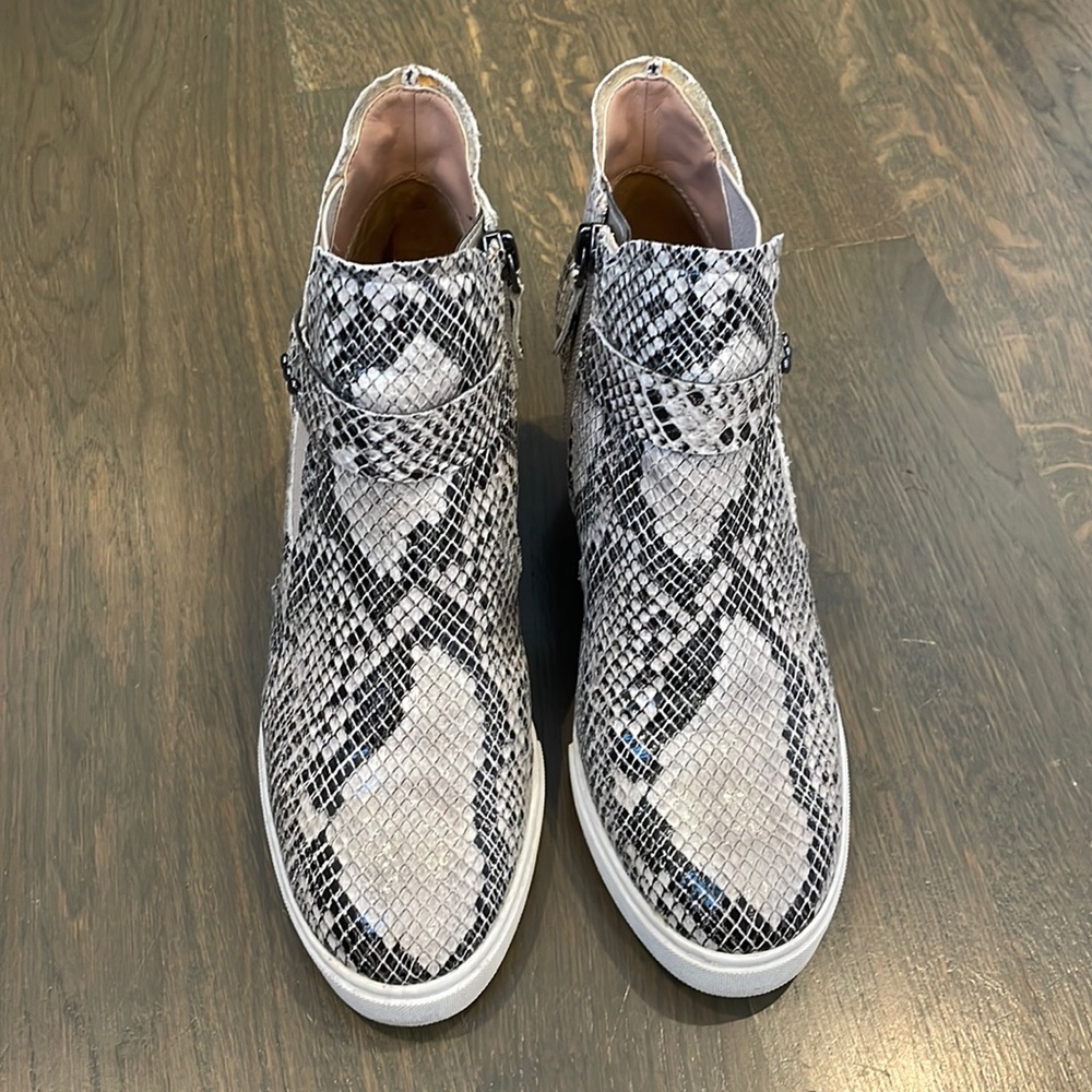 Snakeskin high top shoes.